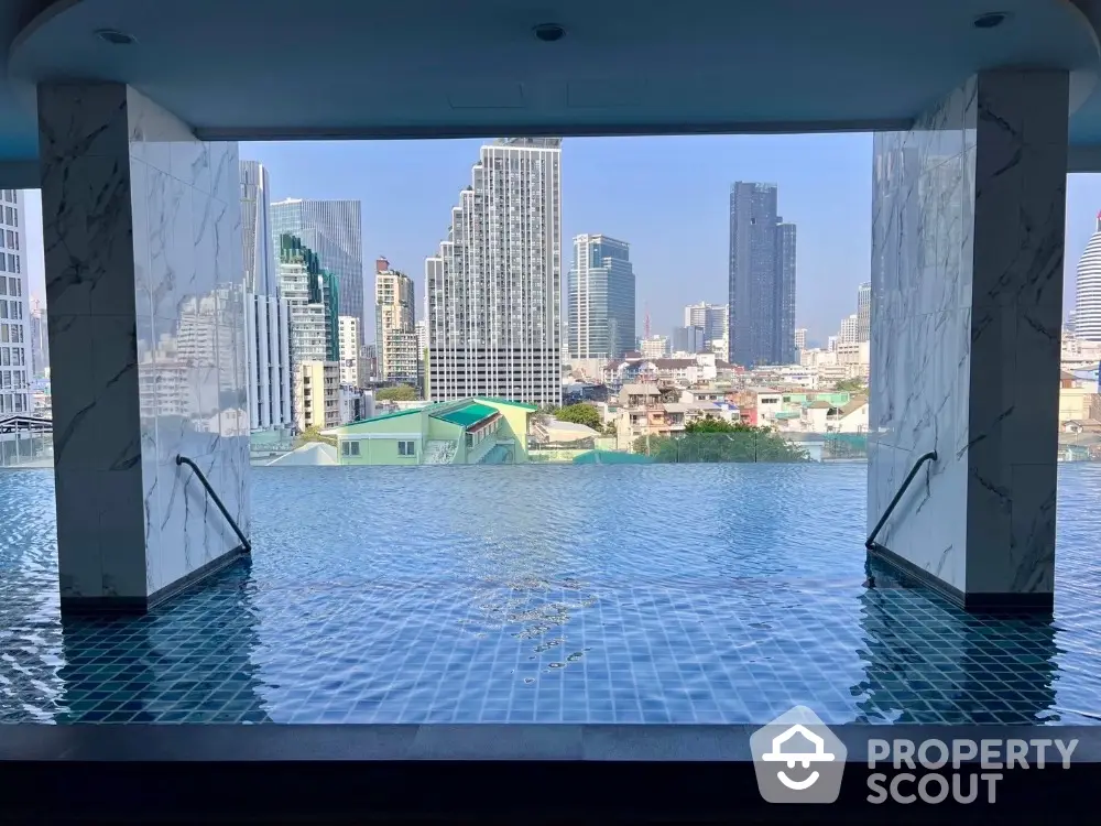 Stunning rooftop infinity pool with breathtaking city skyline view