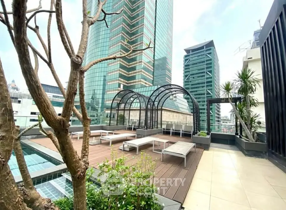 Stunning rooftop terrace with modern design and city views, perfect for relaxation and entertainment.