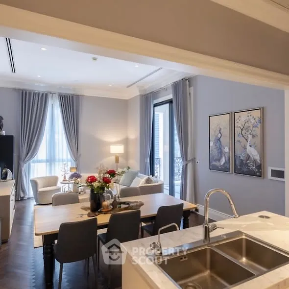 Luxurious open-plan living room with elegant decor and modern kitchen