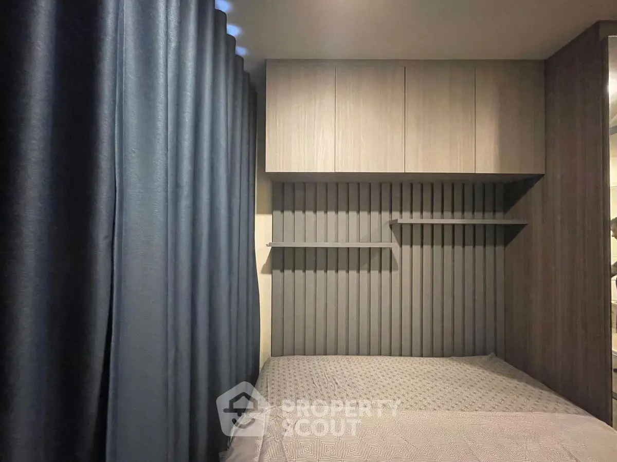 Modern bedroom with sleek cabinetry and stylish wall paneling