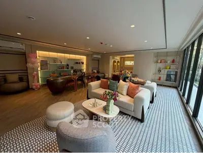 Luxurious modern living room with elegant decor and spacious seating area.
