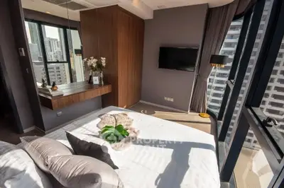 Luxurious bedroom with city view and modern decor in high-rise apartment