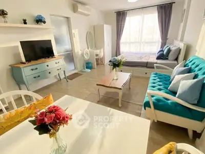 Charming studio apartment with stylish decor, featuring a cozy living area and modern furnishings.