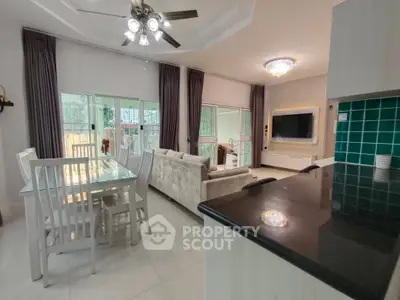 Spacious open-plan living room with modern kitchen and elegant decor