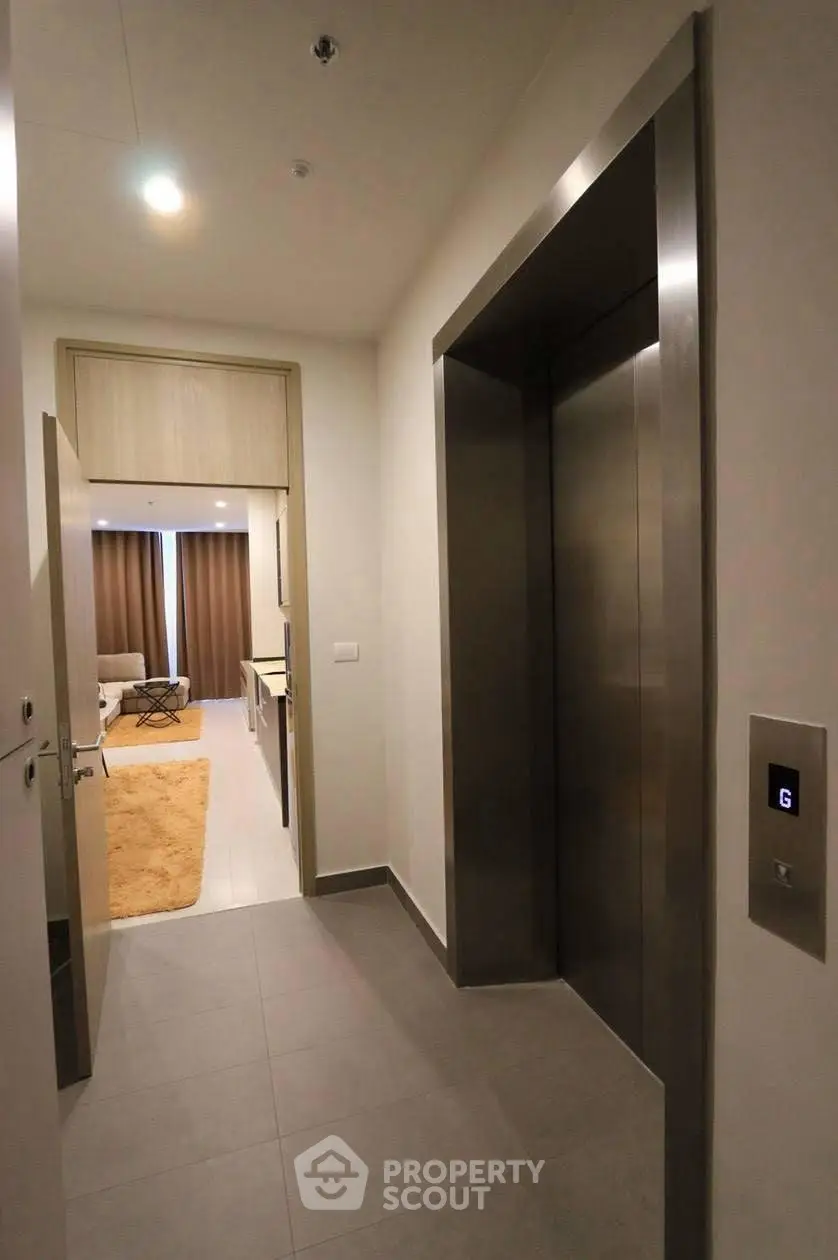 Modern apartment with sleek elevator access and cozy interior design.