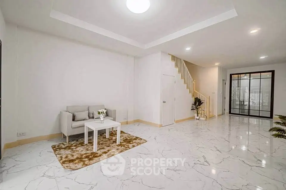 Spacious modern living room with marble flooring and cozy seating area