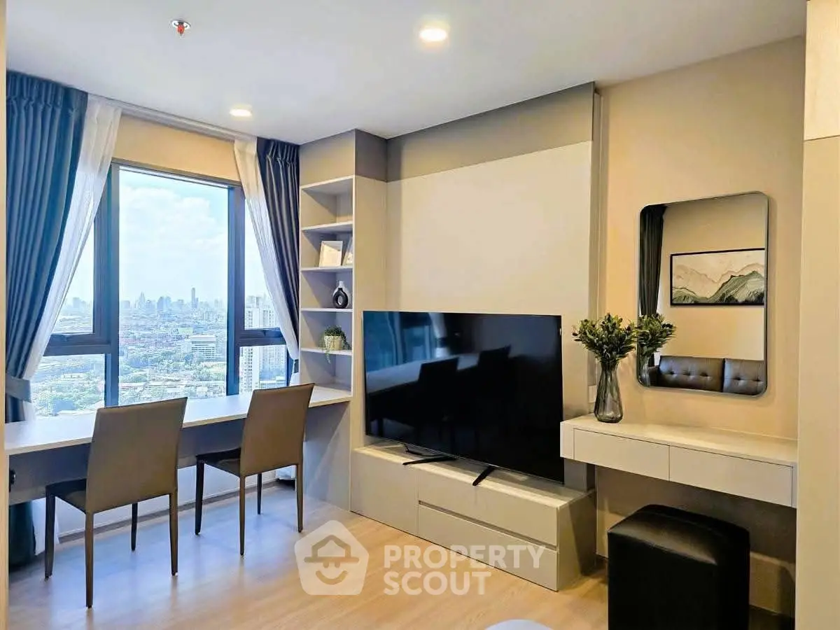 Modern living room with city view, large TV, and stylish decor in high-rise apartment.
