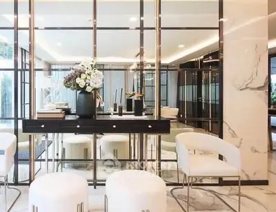 Luxurious modern living room with elegant decor and mirrored walls