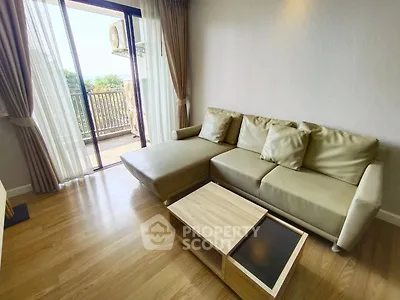 Modern living room with cozy sofa and balcony view
