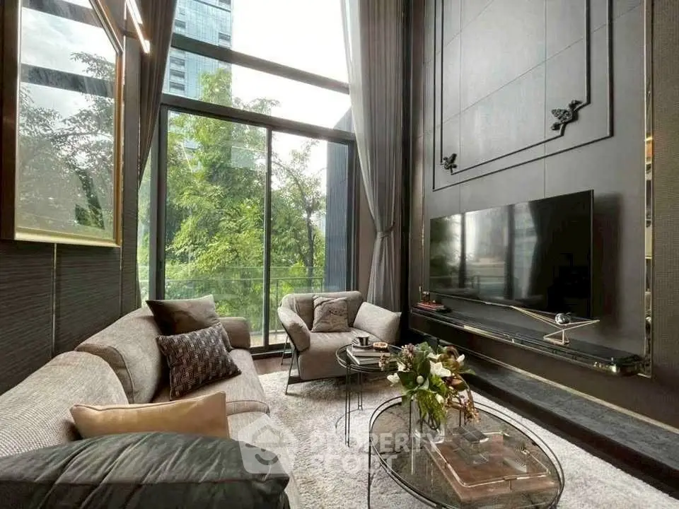 Luxurious high-ceiling living room with modern decor and large windows