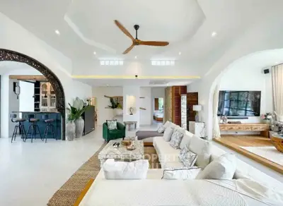 Luxurious open-plan living room with modern decor and spacious seating area.