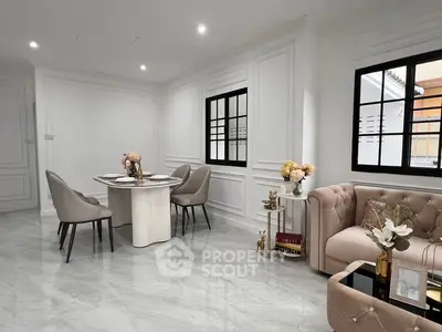 Elegant living room with modern decor, featuring plush seating and a stylish dining area.
