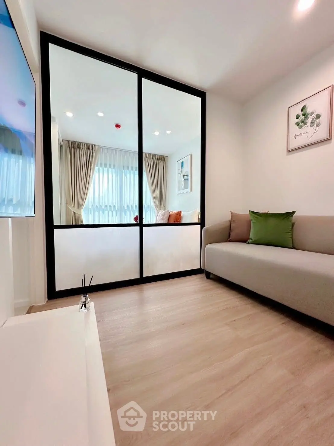 Modern living room with stylish decor and large window for natural light