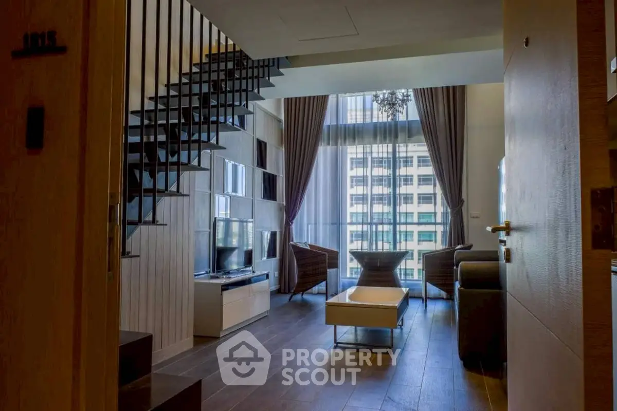 Modern duplex living room with high ceiling and large windows
