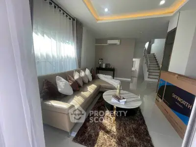 Modern living room with stylish furniture and elegant decor, featuring a cozy sofa and chic coffee table.