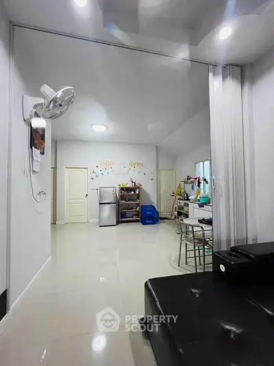 Spacious open-plan living area with modern decor and ample natural light.