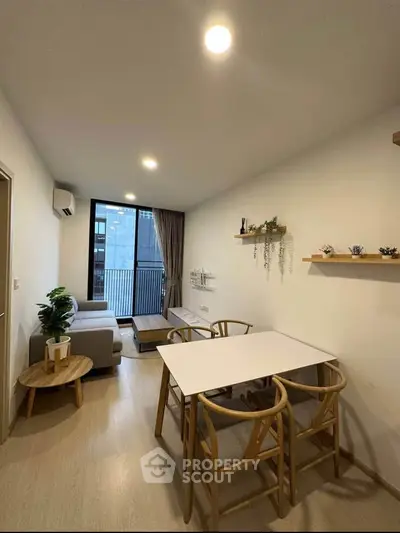 Modern living room with stylish decor and balcony view