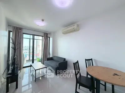 Modern living room with city view, sleek furniture, and natural light.