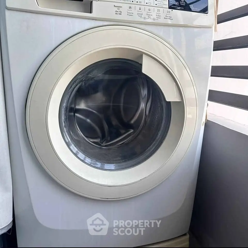 Modern washing machine in a sleek laundry area, perfect for efficient home living.