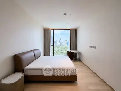 Spacious bedroom with city view and modern furnishings in luxury apartment.