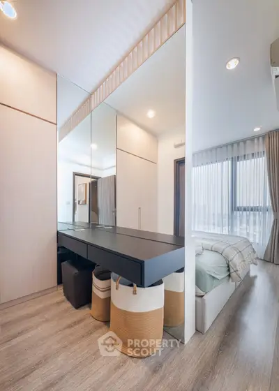 Modern bedroom with stylish decor and ample natural light