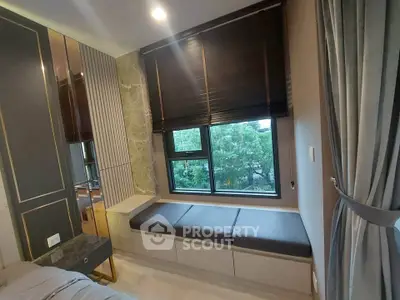 Modern bedroom with stylish window seating and elegant decor