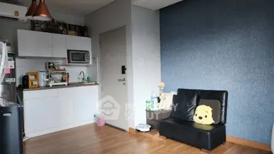 Cozy modern studio apartment with compact kitchen and stylish decor