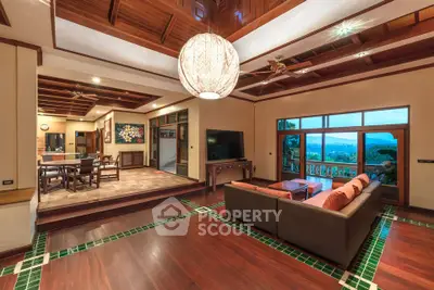 Luxurious living room with stunning view and elegant wooden ceiling