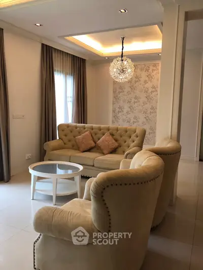 Elegant living room with plush seating and stylish lighting