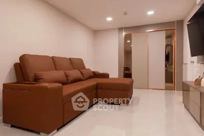 Modern living room with brown sectional sofa and sleek decor