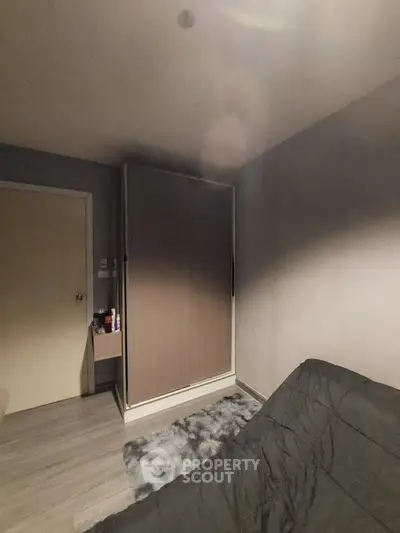 Cozy bedroom with modern wardrobe and stylish decor