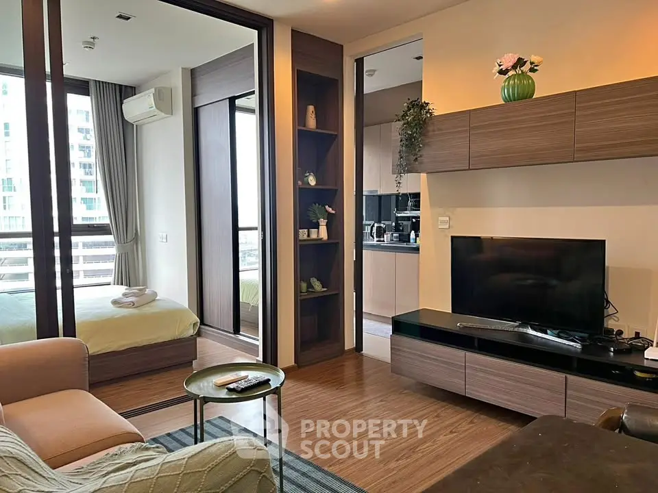 Modern living room with open layout, stylish furniture, and natural light, perfect for urban living.