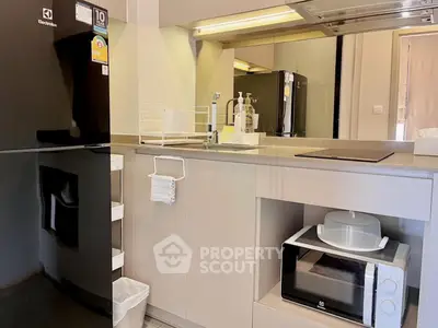 Modern kitchen with sleek appliances and ample storage space