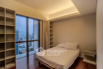 Modern bedroom with city view, featuring sleek shelving and ambient lighting, perfect for urban living.