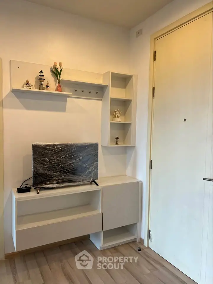 Modern living room with sleek TV stand and decorative shelves