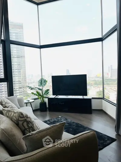 Luxurious corner unit living room with panoramic city views and modern decor.