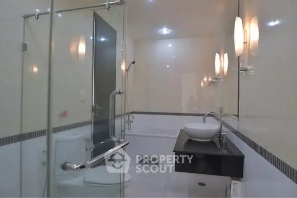 Modern bathroom with glass shower and sleek fixtures