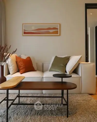 Stylish living room with modern decor and cozy seating area.