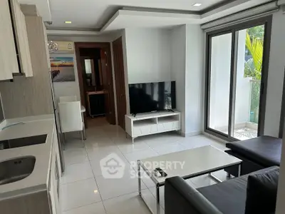Modern living room with sleek furniture and balcony access, perfect for urban living.