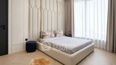 Luxurious modern bedroom with elegant decor and large window