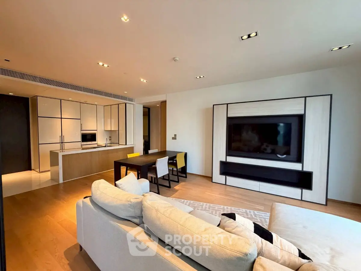 Spacious modern living room with open kitchen and stylish decor