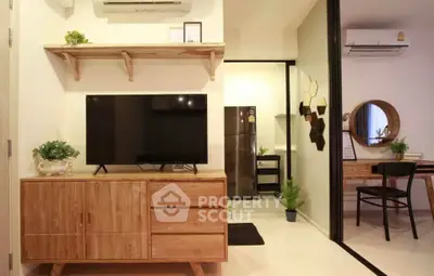 Modern living room with wooden furniture and sleek kitchen area in stylish apartment.