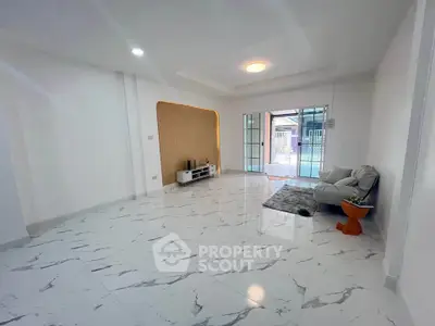 Spacious modern living room with marble flooring and stylish decor