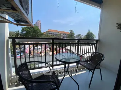 Charming balcony with seating and scenic view, perfect for relaxation and enjoying the outdoors.