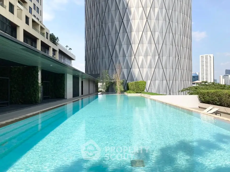 Luxurious rooftop pool with stunning cityscape views and modern architecture.