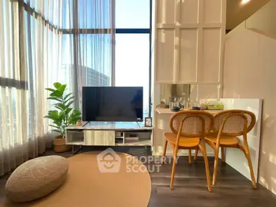 Modern living room with floor-to-ceiling windows and stylish decor