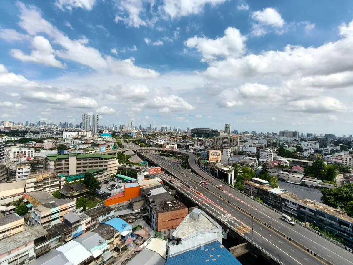 Stunning cityscape view with expansive skyline and highway, perfect for urban living enthusiasts.