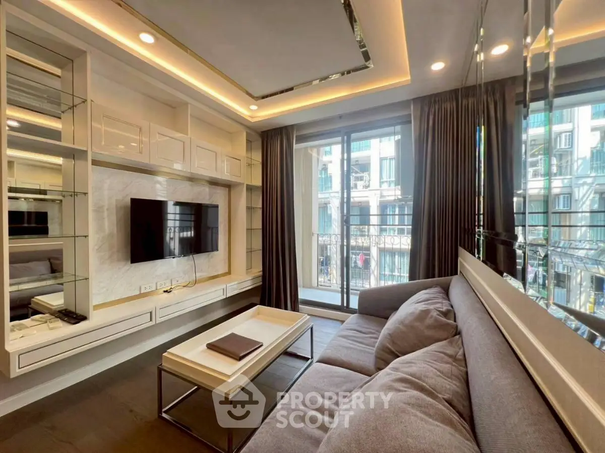 Modern living room with sleek design, large windows, and cozy sofa in a stylish apartment.