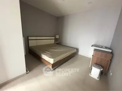 Spacious bedroom with modern bed and minimalist decor
