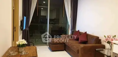 Modern living room with brown sofa and city view balcony in stylish apartment.